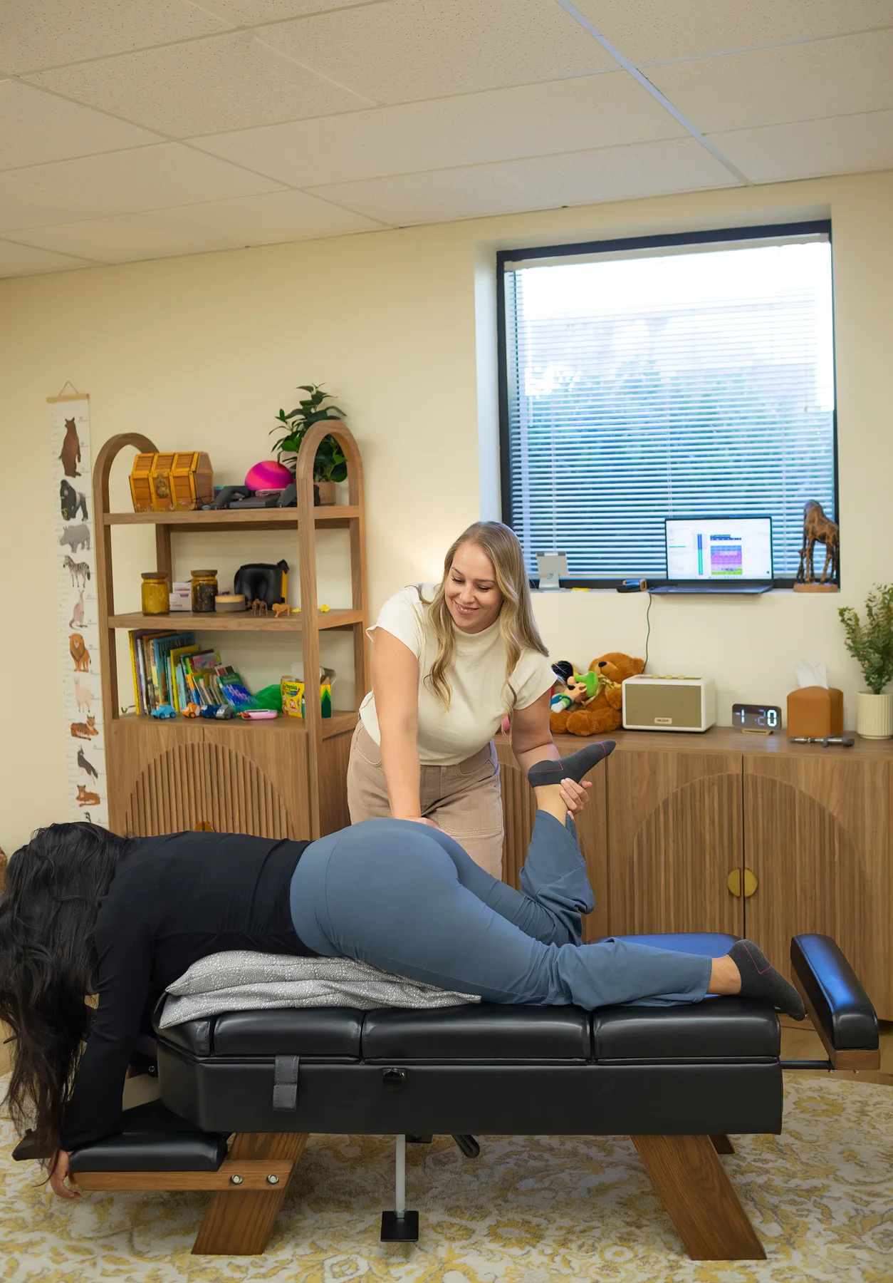 Pregnant patient supported in a side-lying position during prenatal chiropractic care